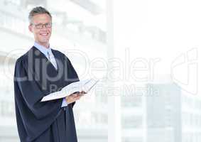 Judge holding book in front of bright background