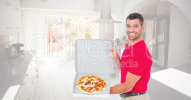 Happy man showing pizza in box