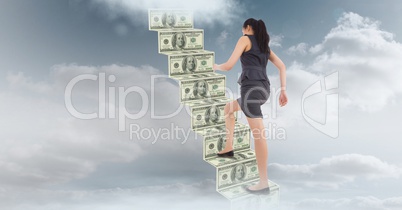 Businesswoman moving up on staircase made of money in sky