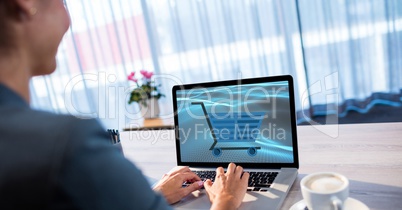 Businesswoman shopping online using laptop