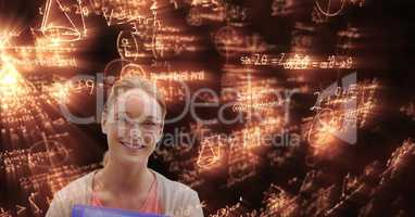 Digital composite image of woman looking at glowing math equations