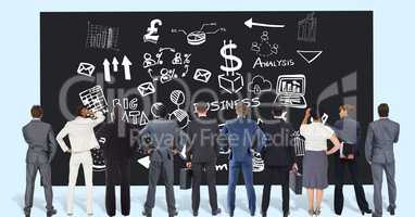 Rear view of professionals looking at business graphics on black board