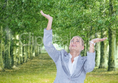 Business woman under the rain in the park