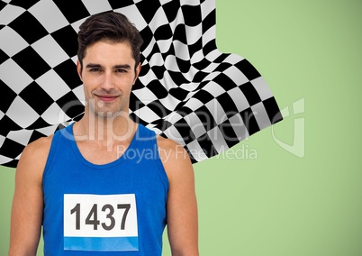 Male runner with number on shirt against green background and checkered flag