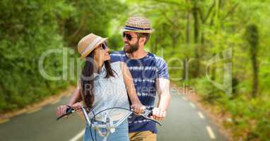 Loving couple riding bicycle during summer vacation