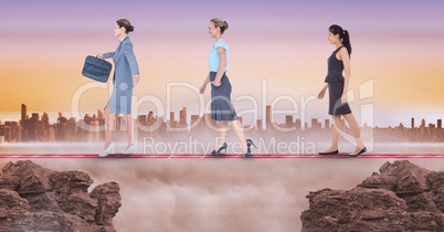 Digital composite image of businesswomen walking on rope during sunset