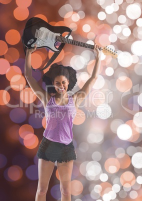 Smiling casual woman playing guitar