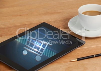 Tablet with Shopping trolley icon and coffee