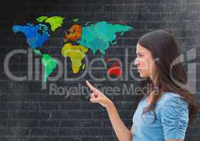 Woman pointing at Colorful Map with wall background