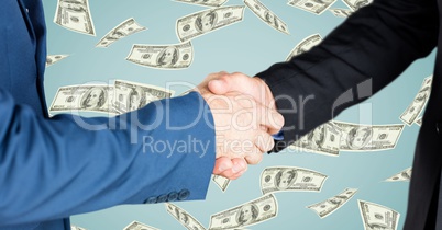 Business people doing handshake money in background
