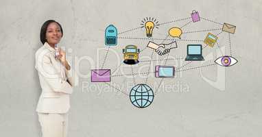 Businesswoman standing by various icons on beige background