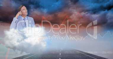 Digital composite image of businessman looking at storm clouds
