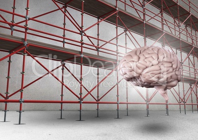 Brain with flare in front of scaffolding in grey room