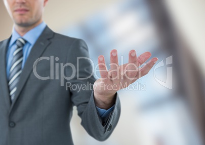 Midsection of businessman gesturing