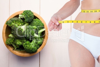 Composite image of woman and vegetables