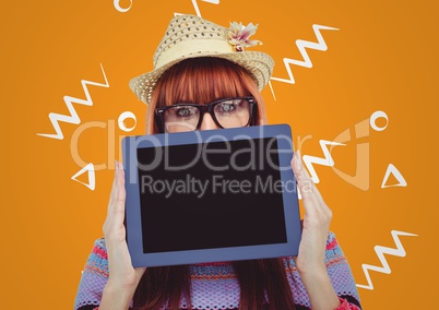 Woman in straw hat with tablet over face against orange background with white patterns