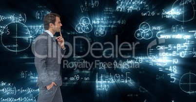Composite image of businessman against mathematics background