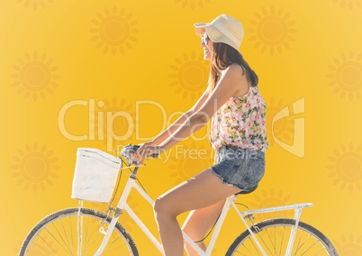Woman on bike against yellow sun pattern