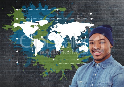 Man smiling net to Colorful Map with paint splatters on wall background