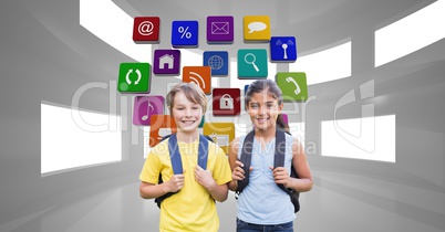 Happy school children carrying backpacks with application icons in background