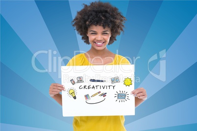 Portrait of woman holding billboard with creativity text against blue background