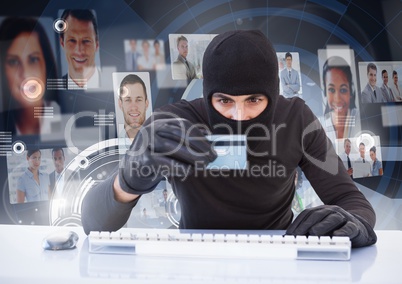 Criminal in hood on laptop with card in front of peoples profile faces