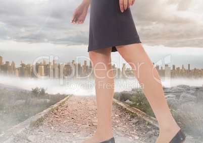 Womans legs Walking on path near city