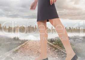 Womans legs Walking on path near city