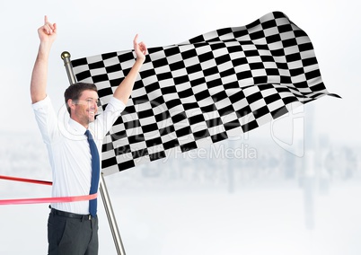 Business man at finish line against white skyline and checkered flag