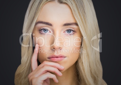 Woman thinking against dark grey background