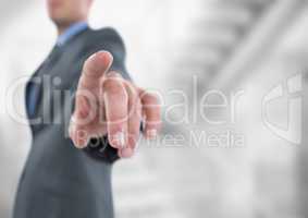 Midsection of businessman pointing