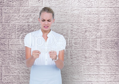 Business woman in front of a wall with look of disgust