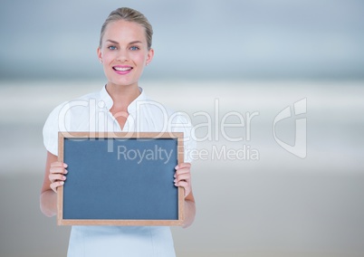 Business woman with blackboard. So blurred background