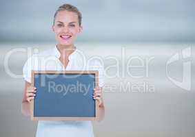 Business woman with blackboard. So blurred background