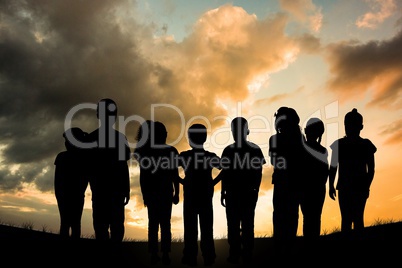 Composite image of group of kids standing outdoor