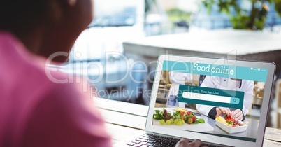 Woman using laptop to search for food online