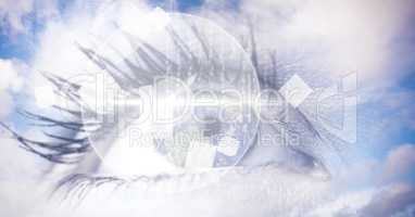 Digital composite image of eye interface with clouds