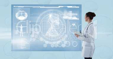 Side view of female doctor looking at futuristic screen