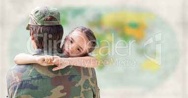 Soldier and daughter against blurry map