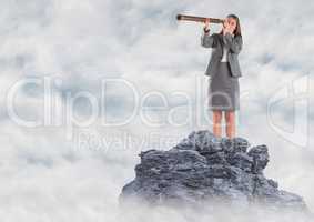 Business woman with telescope on mountain peak in the clouds