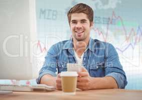 Man at computer with coffee against blue graph