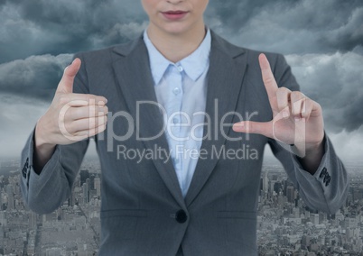 Businesswoman interacting with air with city background