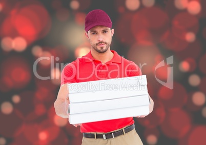 Deliveryman with pizza boxes. Red ;lights bakground