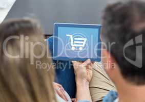 People using Tablet with Shopping trolley icon