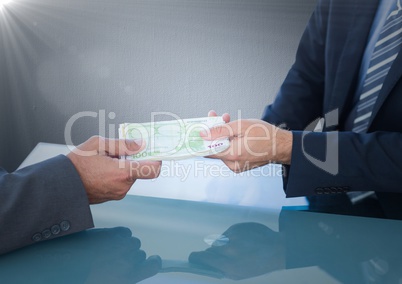 Business money exchange at blue desk against navy background with flare