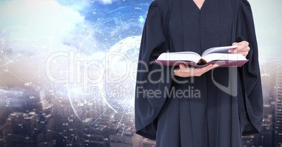 Midsection of judge holding book against screen