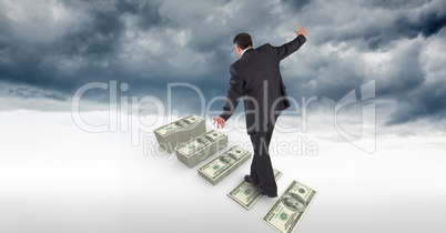 Businessman walking on money steps in sky