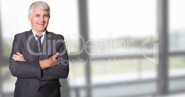 Businessman with arms crossed in office
