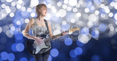 Music artist playing guitar over bokeh