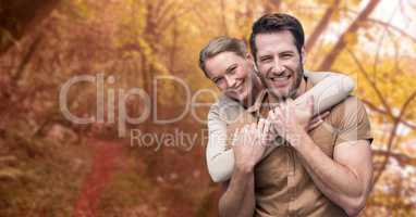 happy woman embracing man during autumn